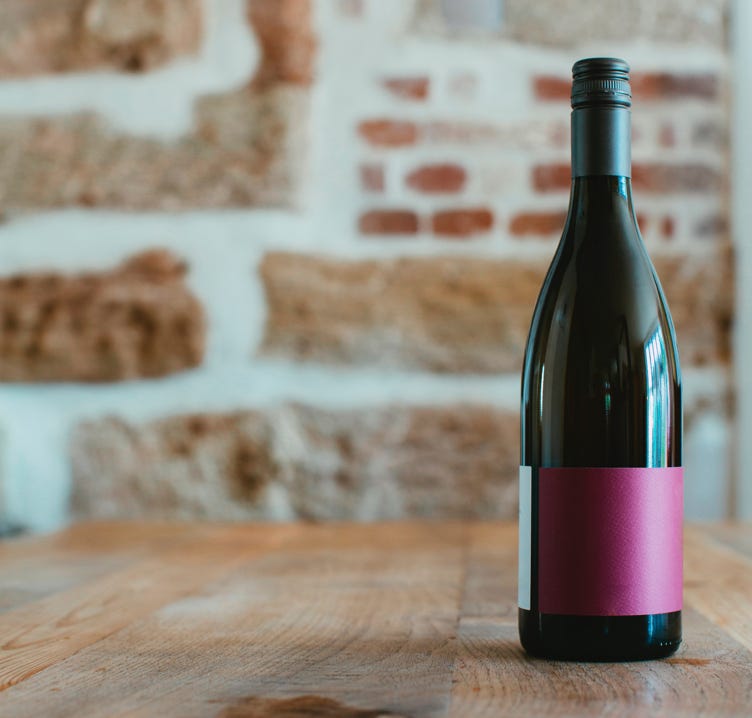 Wine bottle, brick background